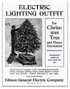 Historic newspaper ad in black and white showing a person with a lighted Christmas tree.
